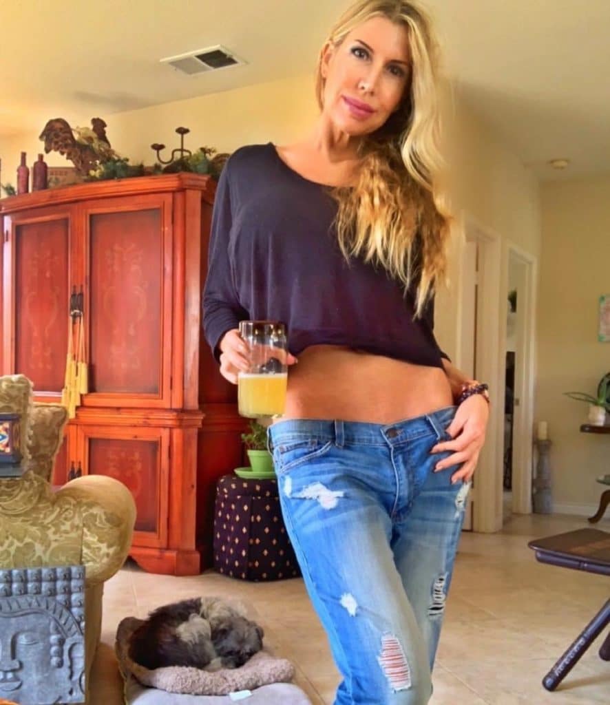 Andrea Cox with drink and rescue dog